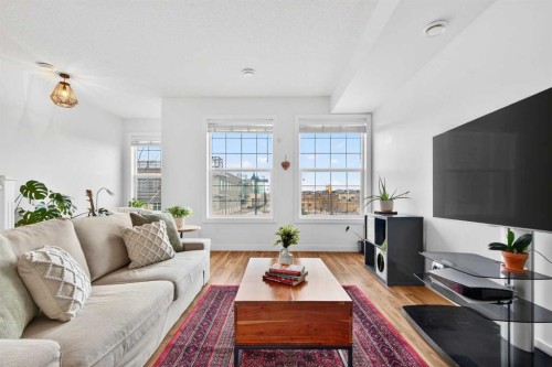 9-43 Springborough Boulevard Sw, Calgary, AB - Indoor Photo Showing Living Room