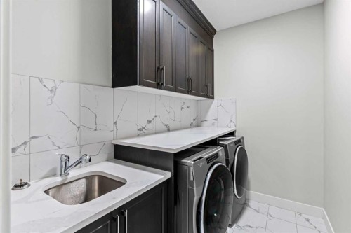 111 Kinniburgh Place, Chestermere, AB - Indoor Photo Showing Laundry Room