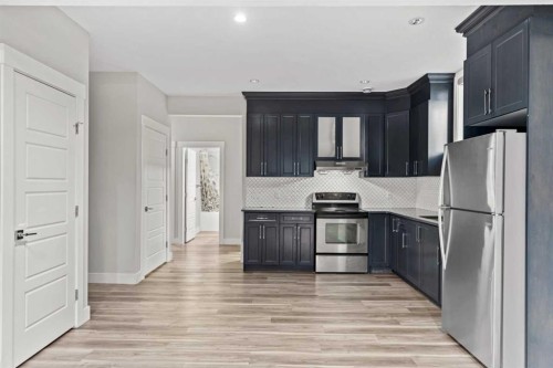 111 Kinniburgh Place, Chestermere, AB - Indoor Photo Showing Kitchen With Stainless Steel Kitchen