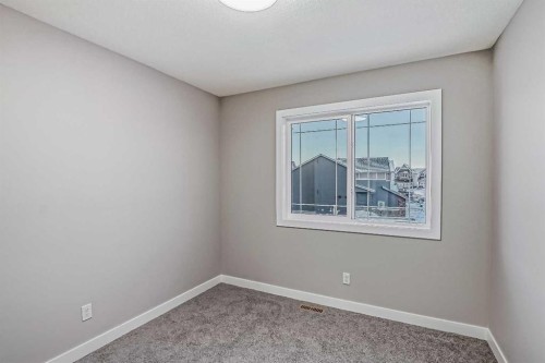 39 Agate Road, Cochrane, AB - Indoor Photo Showing Other Room