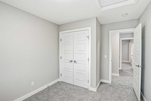 39 Agate Road, Cochrane, AB - Indoor Photo Showing Other Room