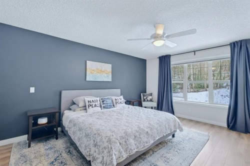 105 Riviera Crescent, Cochrane, AB - Indoor Photo Showing Bedroom