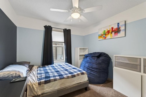 105 Riviera Crescent, Cochrane, AB - Indoor Photo Showing Bedroom