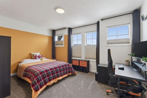 105 Riviera Crescent, Cochrane, AB - Indoor Photo Showing Bedroom
