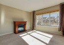 236 Silverado Drive Sw, Calgary, AB  - Indoor Photo Showing Living Room With Fireplace 