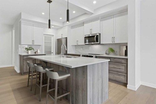 8 Topaz Place, Cochrane, AB - Indoor Photo Showing Kitchen With Upgraded Kitchen