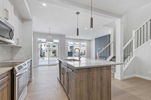 8 Topaz Place, Cochrane, AB - Indoor Photo Showing Kitchen With Upgraded Kitchen