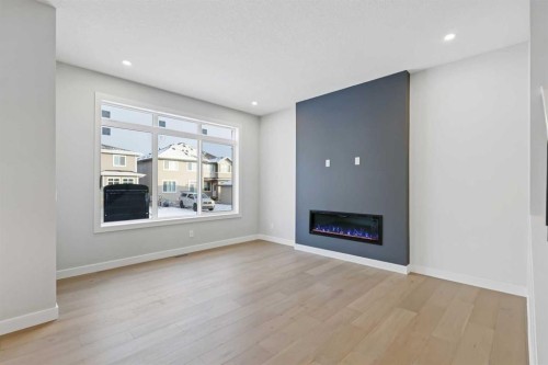 8 Topaz Place, Cochrane, AB - Indoor Photo Showing Living Room With Fireplace