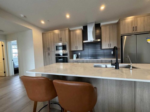 1207-55 Lucas Nw, Calgary, AB - Indoor Photo Showing Kitchen With Double Sink