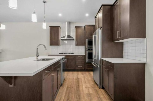 136 Wolf Hollow Manor Se, Calgary, AB - Indoor Photo Showing Kitchen With Upgraded Kitchen