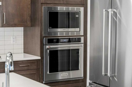 136 Wolf Hollow Manor Se, Calgary, AB - Indoor Photo Showing Kitchen With Upgraded Kitchen