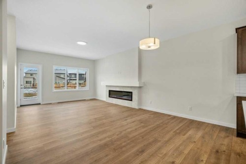 136 Wolf Hollow Manor Se, Calgary, AB - Indoor Photo Showing Living Room With Fireplace