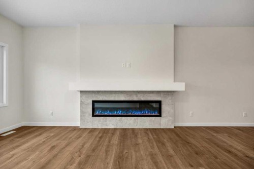 136 Wolf Hollow Manor Se, Calgary, AB - Indoor Photo Showing Living Room With Fireplace