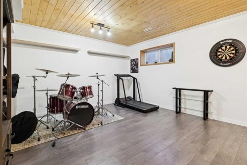 26 Mount Rae Terrace, Okotoks, AB - Indoor Photo Showing Gym Room