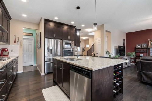 26 Mount Rae Terrace, Okotoks, AB - Indoor Photo Showing Kitchen With Stainless Steel Kitchen With Double Sink With Upgraded Kitchen