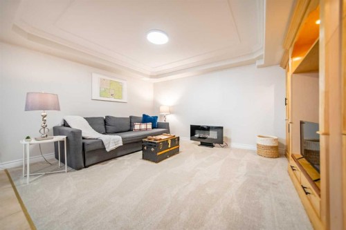 4 Cedargrove Road Sw, Calgary, AB - Indoor Photo Showing Other Room With Fireplace