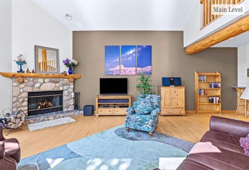 18 Juniper Ridge, Canmore, AB - Indoor Photo Showing Living Room With Fireplace
