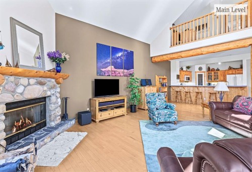 18 Juniper Ridge, Canmore, AB - Indoor Photo Showing Living Room With Fireplace