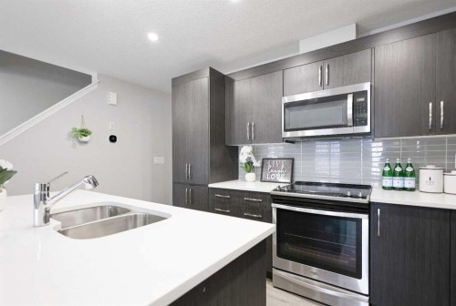 231 Windford Crescent Sw, Airdrie, AB - Indoor Photo Showing Kitchen With Double Sink With Upgraded Kitchen