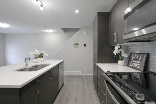 231 Windford Crescent Sw, Airdrie, AB - Indoor Photo Showing Kitchen With Double Sink