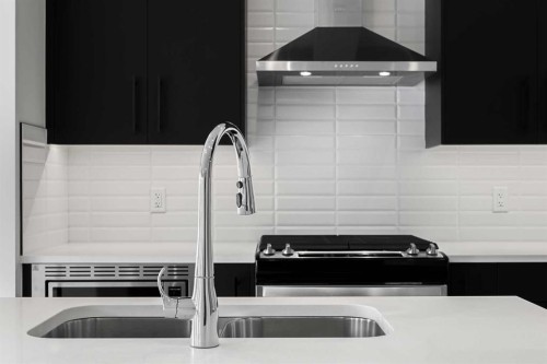 26 Walgrove Bay Se, Calgary, AB - Indoor Photo Showing Kitchen With Stainless Steel Kitchen With Double Sink With Upgraded Kitchen