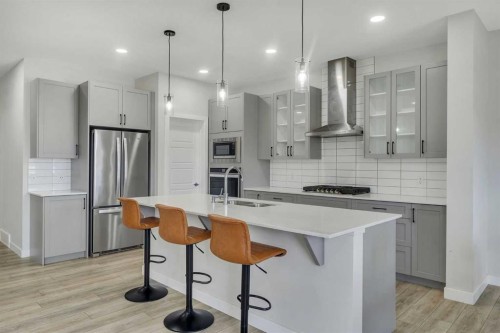 15 Midgrove Drive Sw, Airdrie, AB - Indoor Photo Showing Kitchen With Upgraded Kitchen