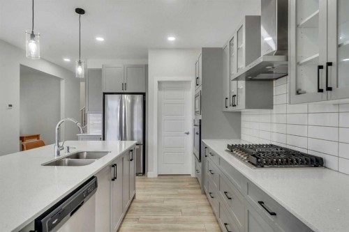 15 Midgrove Drive Sw, Airdrie, AB - Indoor Photo Showing Kitchen With Double Sink With Upgraded Kitchen