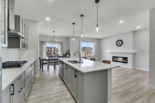 15 Midgrove Drive Sw, Airdrie, AB - Indoor Photo Showing Kitchen With Double Sink With Upgraded Kitchen