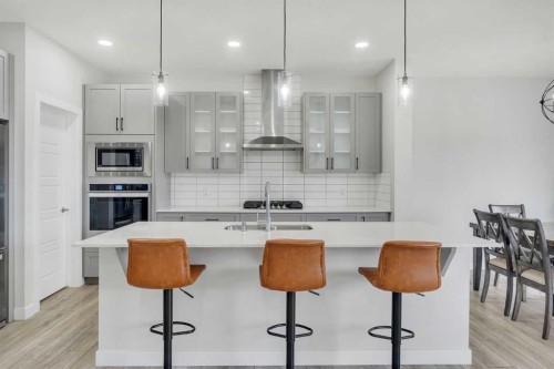 15 Midgrove Drive Sw, Airdrie, AB - Indoor Photo Showing Kitchen With Upgraded Kitchen