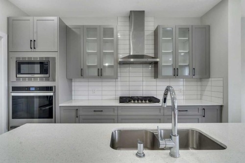 15 Midgrove Drive Sw, Airdrie, AB - Indoor Photo Showing Kitchen With Double Sink With Upgraded Kitchen