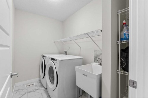 15 Midgrove Drive Sw, Airdrie, AB - Indoor Photo Showing Laundry Room