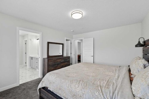 15 Midgrove Drive Sw, Airdrie, AB - Indoor Photo Showing Bedroom