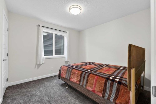 15 Midgrove Drive Sw, Airdrie, AB - Indoor Photo Showing Bedroom