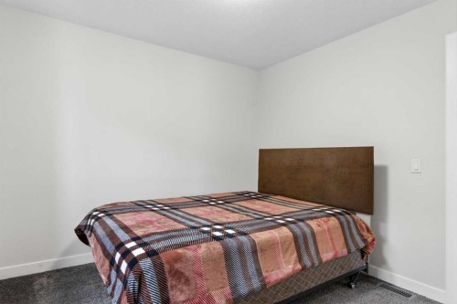 15 Midgrove Drive Sw, Airdrie, AB - Indoor Photo Showing Bedroom