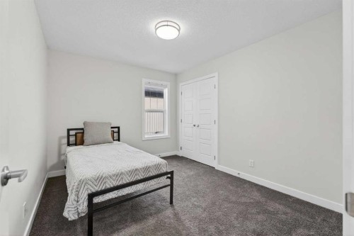 15 Midgrove Drive Sw, Airdrie, AB - Indoor Photo Showing Bedroom