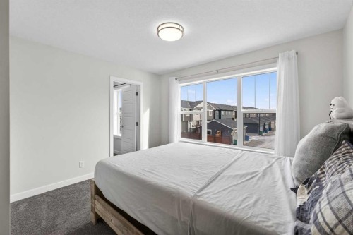 15 Midgrove Drive Sw, Airdrie, AB - Indoor Photo Showing Bedroom