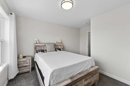 15 Midgrove Drive Sw, Airdrie, AB - Indoor Photo Showing Bedroom