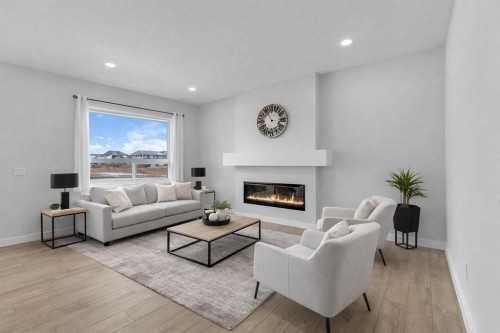 15 Midgrove Drive Sw, Airdrie, AB - Indoor Photo Showing Living Room With Fireplace