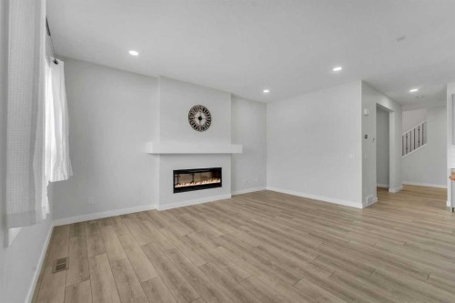 15 Midgrove Drive Sw, Airdrie, AB - Indoor Photo Showing Living Room With Fireplace