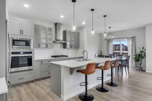 15 Midgrove Drive Sw, Airdrie, AB - Indoor Photo Showing Kitchen With Upgraded Kitchen