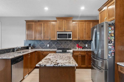 91 Kinlea Link Nw, Calgary, AB - Indoor Photo Showing Kitchen With Double Sink