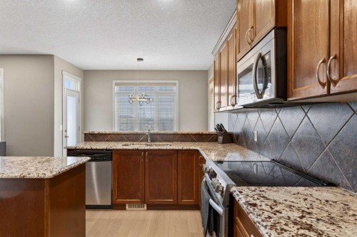 91 Kinlea Link Nw, Calgary, AB - Indoor Photo Showing Kitchen With Double Sink With Upgraded Kitchen