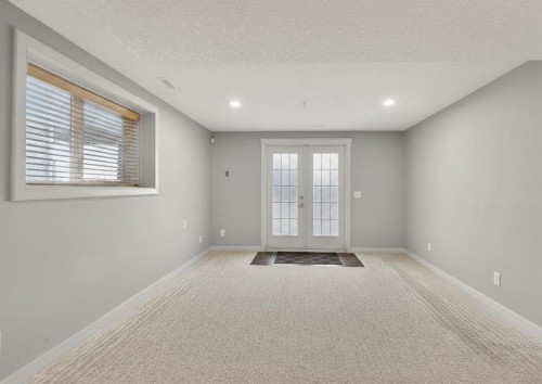 91 Kinlea Link Nw, Calgary, AB - Indoor Photo Showing Other Room