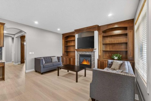 91 Kinlea Link Nw, Calgary, AB - Indoor With Fireplace