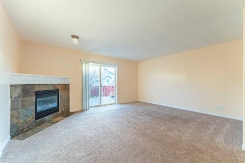 224 Highland Circle, Strathmore, AB - Indoor With Fireplace