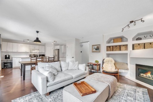 249 Mt.Douglas Circle Se, Calgary, AB - Indoor Photo Showing Living Room With Fireplace