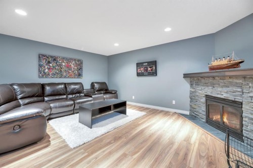 249 Mt.Douglas Circle Se, Calgary, AB - Indoor Photo Showing Living Room With Fireplace