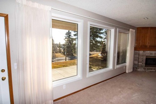 16 Eagleview Heights Nw, Cochrane, AB - Indoor With Fireplace