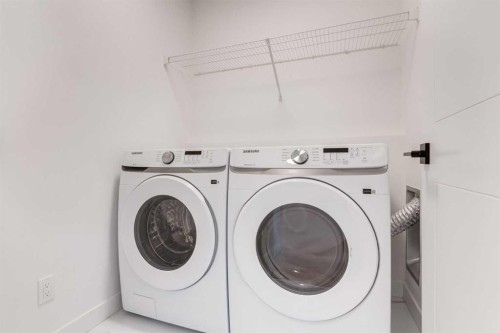 203 Tillotson Drive, Okotoks, AB - Indoor Photo Showing Laundry Room