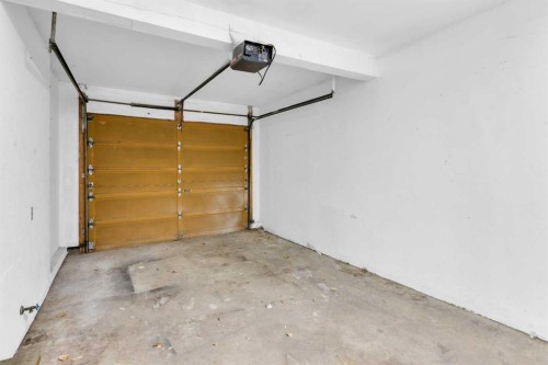 1418 Ranchlands Road Nw, Calgary, AB - Indoor Photo Showing Garage